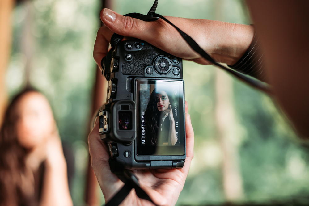 Close up of a camera screen with a portrait of a woman