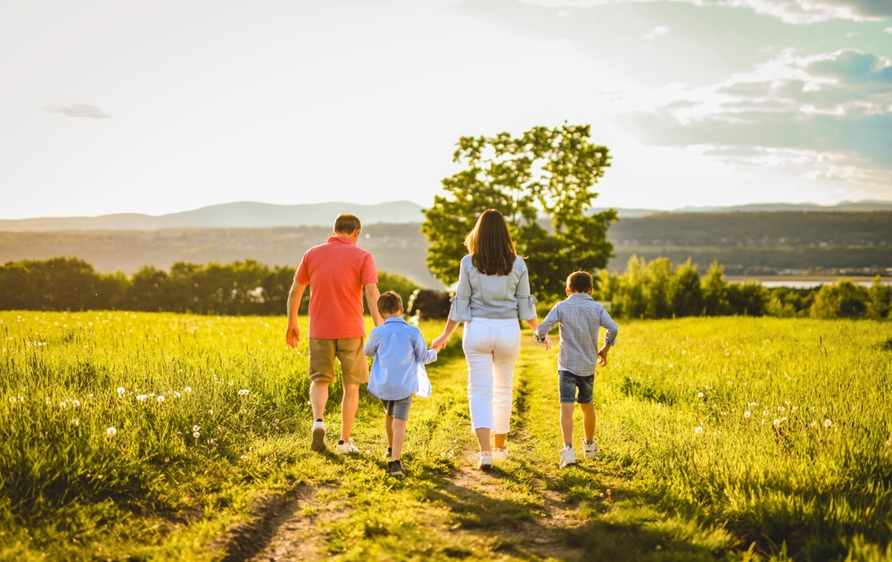 golden hour family portrait in a field