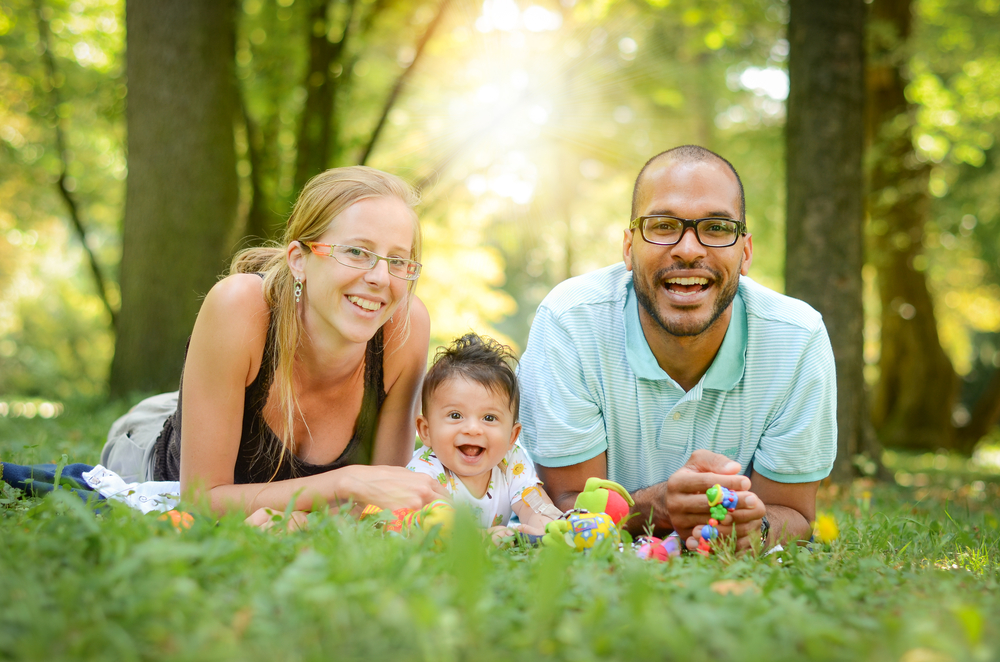 interracial family portrait in the park