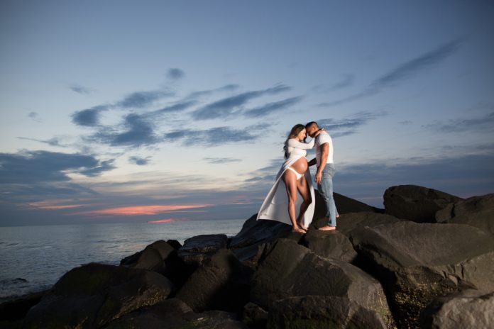 Maternity Photo of Couple on a rocky beach