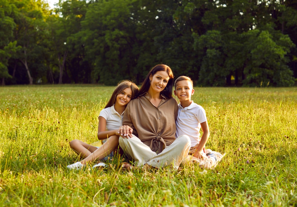 mother and children in summer field
