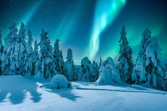 Northern lights in winter mountains
