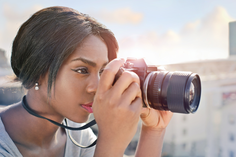 Photographer holding her camera properly