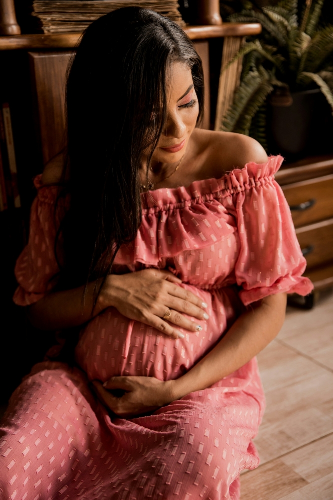 Pregnant woman in a pink dress