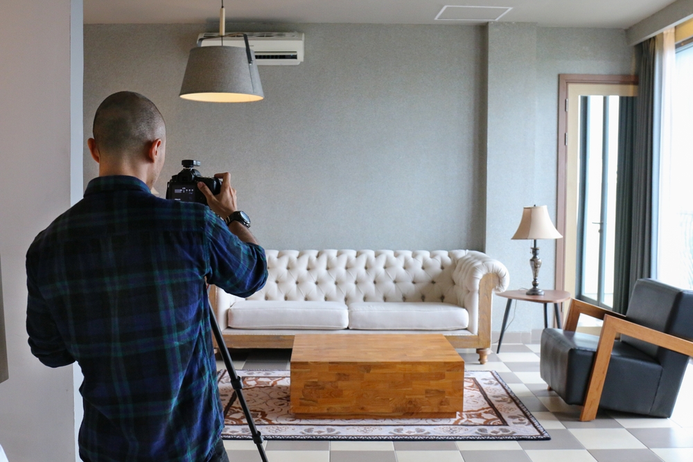 professional photographer shooting a living room for real estate