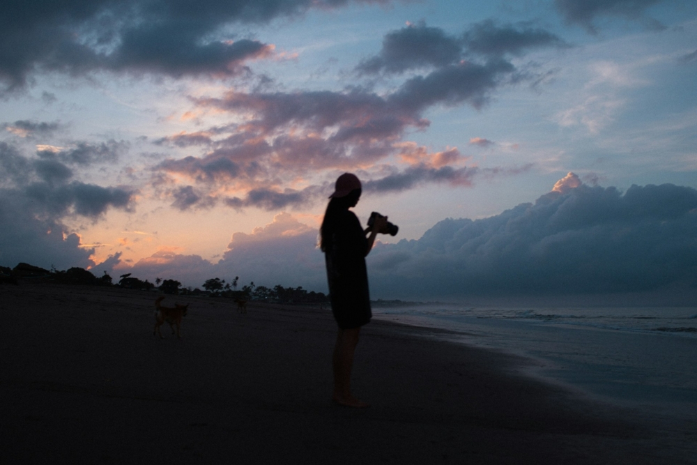 Silhouette of a girl with a camera