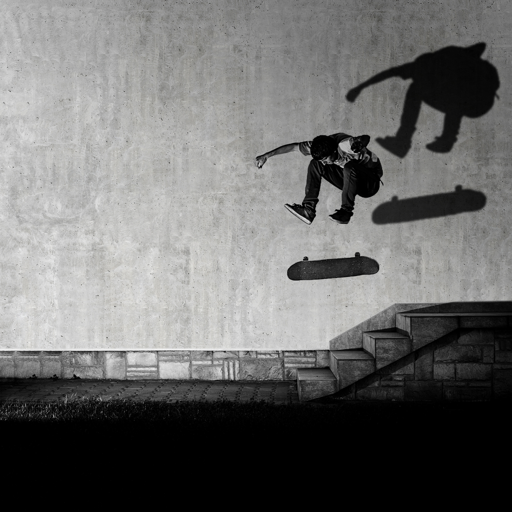 skateboarder in black and white