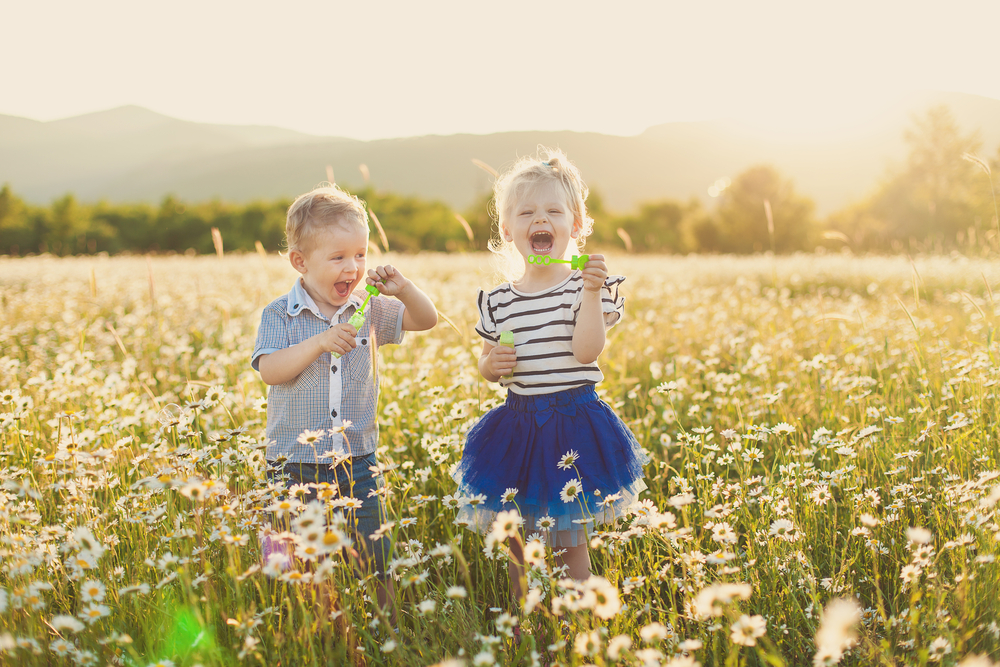 spring portrait of kids in a field