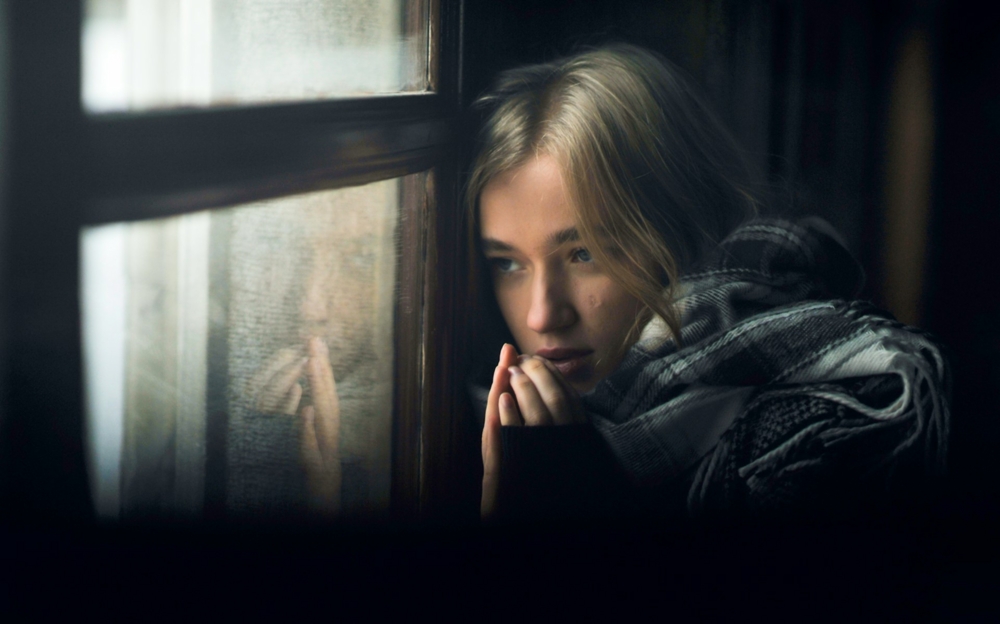 woman looking out of a window