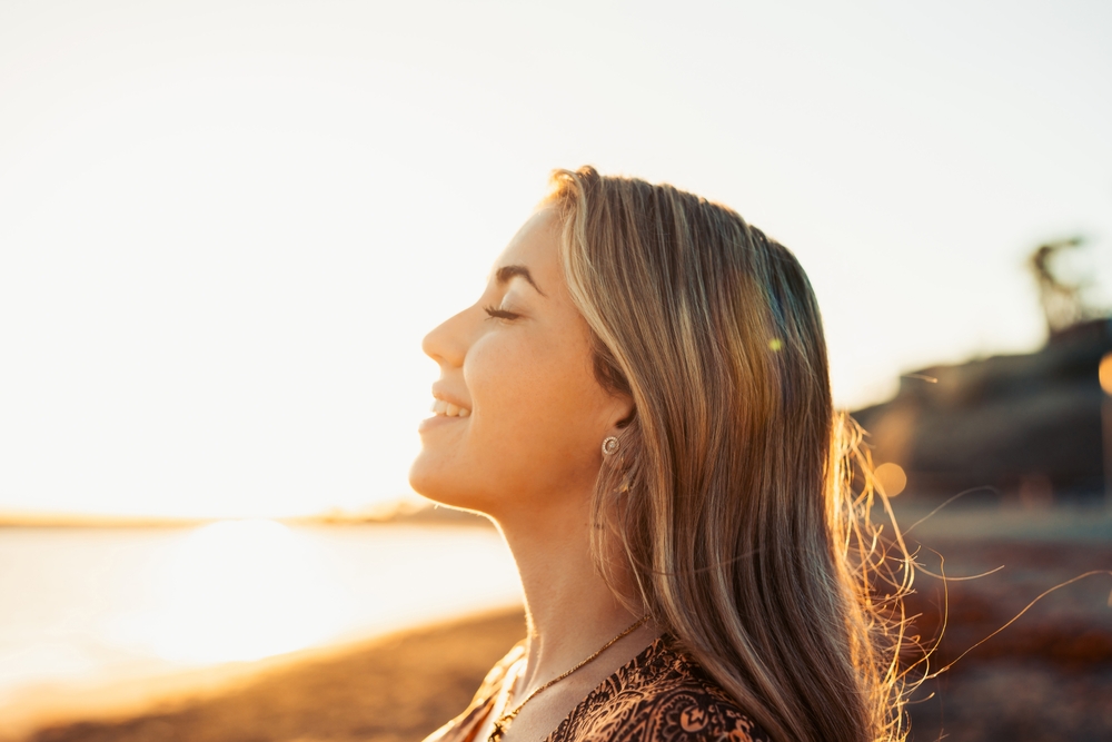 woman outside at sunset
